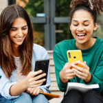 Students voting online on their phones in an SRC election